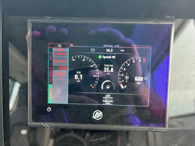 Slide: The Image of Dashboard display of 2020 Axopar 28 CABIN showing system status and fuel levels. - 26