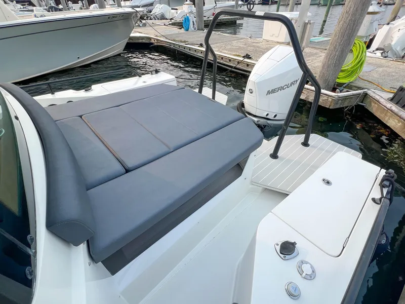 Slide: The Image of 2020 Axopar 28 CABIN boat with Mercury engine at dock. - 5