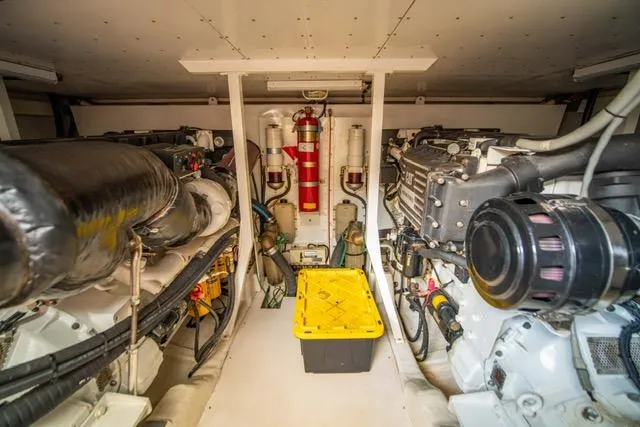 Slide: The Image of Engine room of 2005 Neptunus 62 Flybridge yacht, featuring dual engines and equipment. - 12