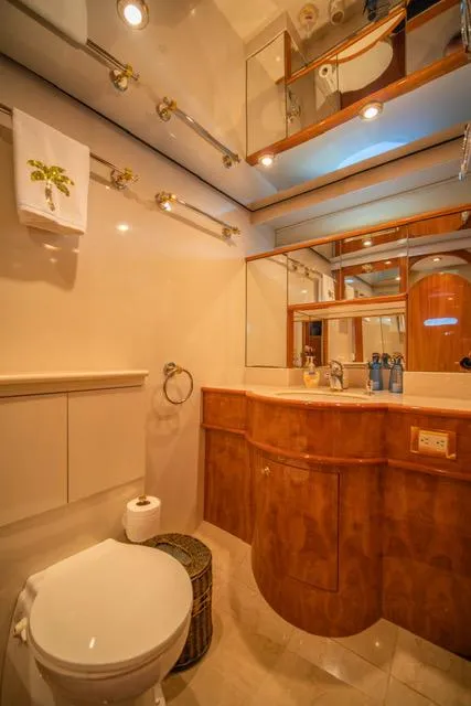 Slide: The Image of Luxurious bathroom in 2005 Neptunus 62 Flybridge yacht with elegant wood cabinetry. - 19