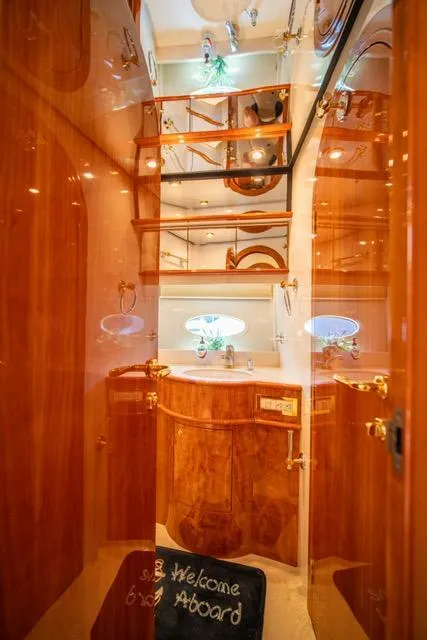 Slide: The Image of Luxurious 2005 Neptunus 62 Flybridge yacht interior with polished wood finishes. - 24