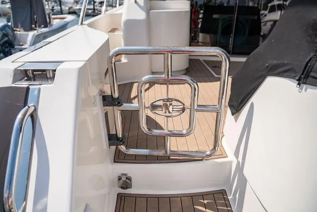 Slide: The Image of Neptunus 62 Flybridge 2005 yacht deck with stainless steel gate. - 34