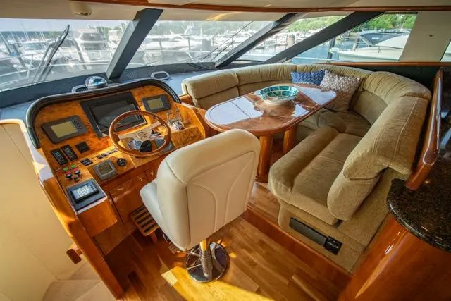 Slide: The Image of Luxurious 2005 Neptunus 62 Flybridge yacht interior with plush seating and elegant helm. - 35