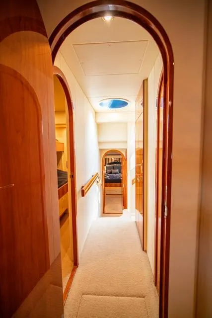 Slide: The Image of Interior hallway of 2005 Neptunus 62 Flybridge yacht with wooden accents. - 36