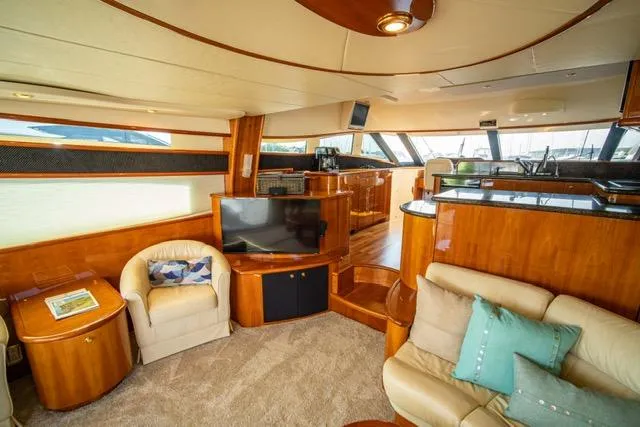 Slide: The Image of Luxurious interior of 2005 Neptunus 62 Flybridge yacht with plush seating and modern amenities. - 37