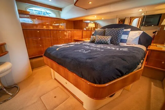 Slide: The Image of Luxurious bedroom interior of 2005 Neptunus 62 Flybridge yacht with elegant wood finishes. - 39