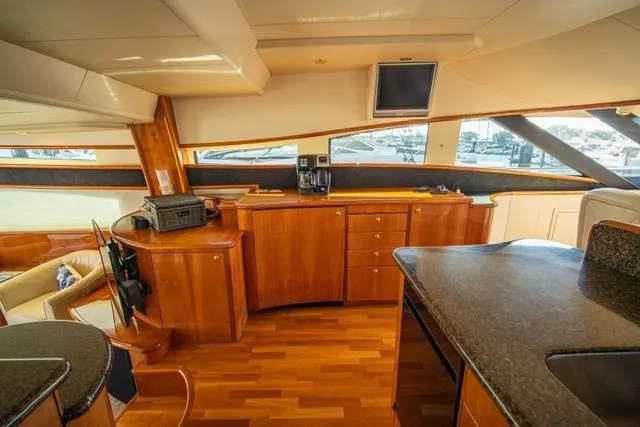 Slide: The Image of Luxurious 2005 Neptunus 62 Flybridge yacht interior with wood cabinetry and modern amenities. - 43
