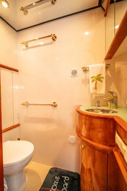 Slide: The Image of Luxurious bathroom in 2005 Neptunus 62 Flybridge yacht with elegant wood finishes. - 47