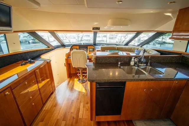 Slide: The Image of Luxurious 2005 Neptunus 62 Flybridge yacht interior with modern kitchen and panoramic windows. - 8