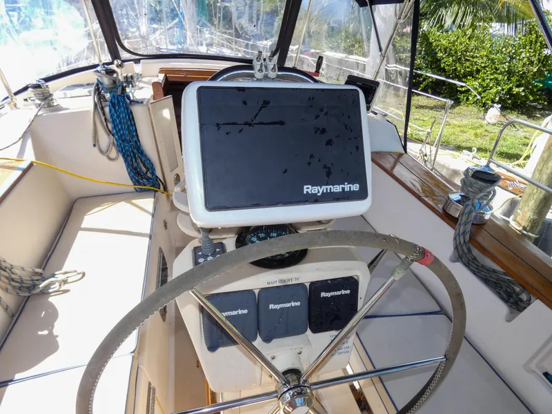 Slide: The Image of Island Packet 420 yacht helm, 2002 model, featuring Raymarine navigation system. - 23