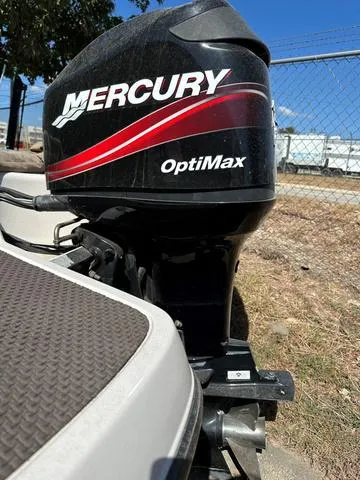 Slide: The Image of Mercury OptiMax engine on 2005 Sun Tracker 189 SPORT boat, outdoor setting. - 10