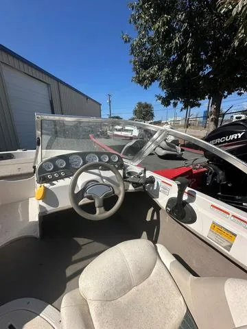 Slide: The Image of 2005 Sun Tracker 189 SPORT boat interior with steering wheel and dashboard. - 7
