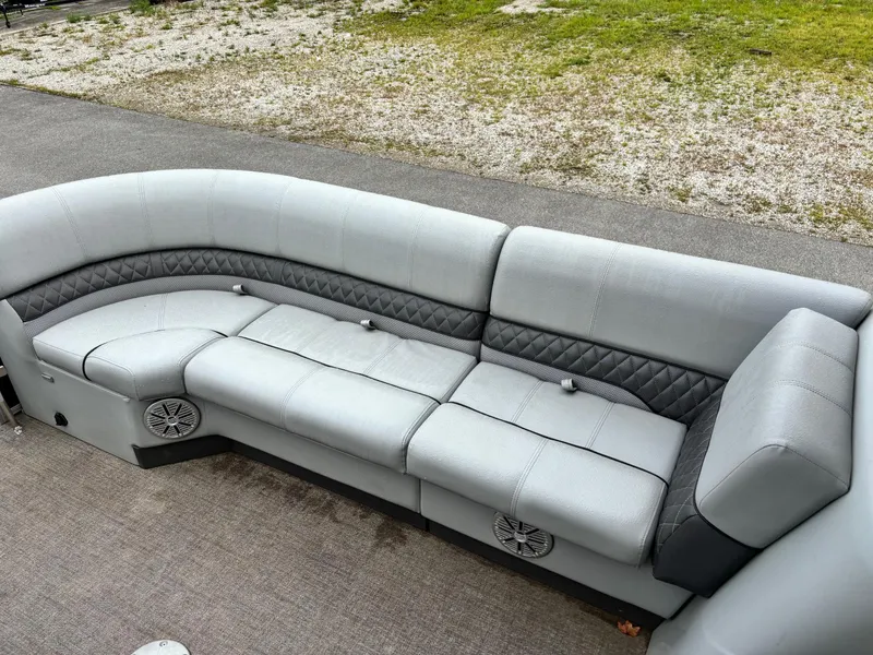 Slide: The Image of 2021 Ranger 223FC boat seating with gray upholstery and built-in speakers. - 3