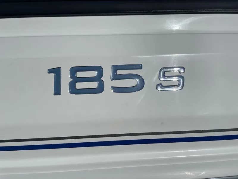 Slide: The Image of 2024 Tahoe 185 S boat model emblem on white surface. - 2