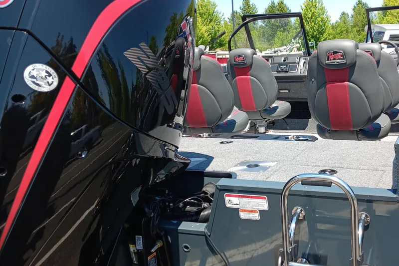 Slide: The Image of 2024 Ranger VX1988 WT boat interior with red-accented seats and motor detail. - 3