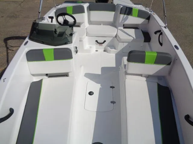 Slide: The Image of 2024 Tahoe T18 boat interior with modern seating and steering wheel. - 10