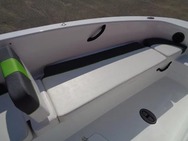 Slide: The Image of 2024 Tahoe T18 boat interior with cushioned seating and modern design. - 11