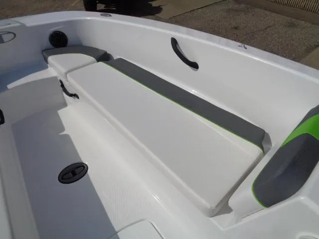 Slide: The Image of 2024 Tahoe T18 boat interior with cushioned seating and modern design. - 12