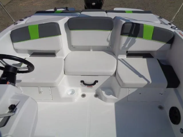 Slide: The Image of 2024 Tahoe T18 boat interior with white and green seating. - 7