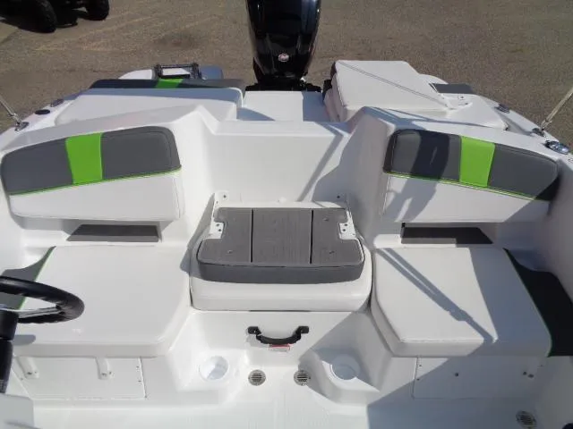 Slide: The Image of 2024 Tahoe T18 boat interior with gray and green seating. - 8