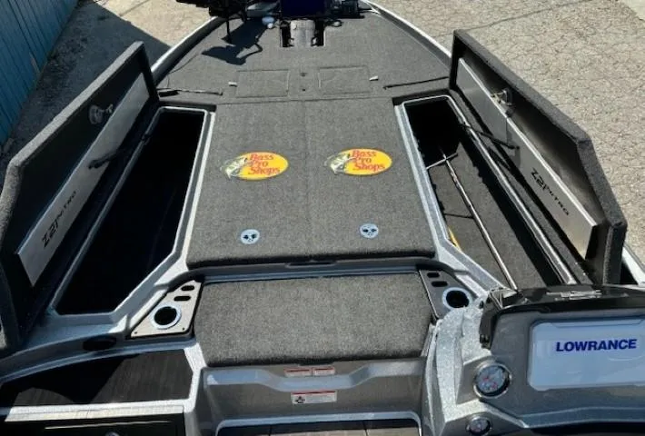 Slide: The Image of 2023 Nitro Z21 XL boat interior with storage compartments and Lowrance electronics. - 11