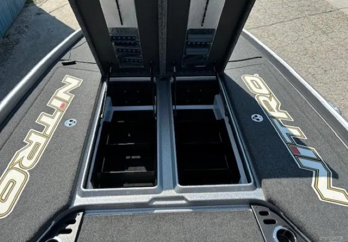 Slide: The Image of 2023 Nitro Z21 XL boat storage compartments open on deck. - 13