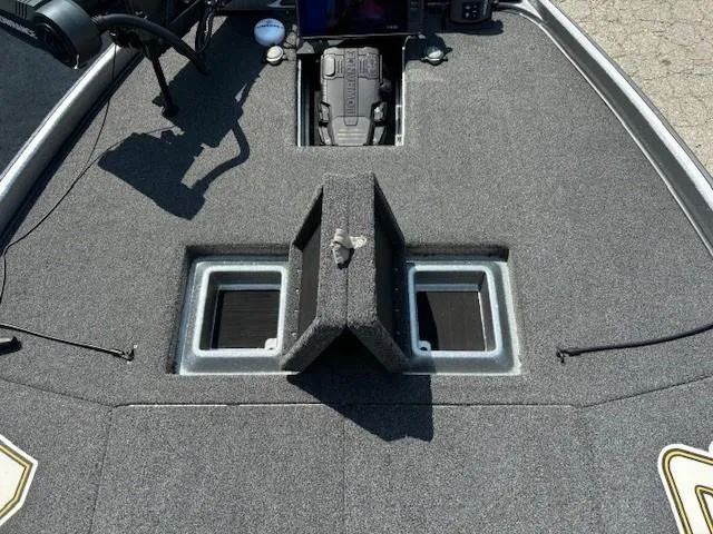 Slide: The Image of 2023 Nitro Z21 XL boat deck with storage compartments and control panel. - 15