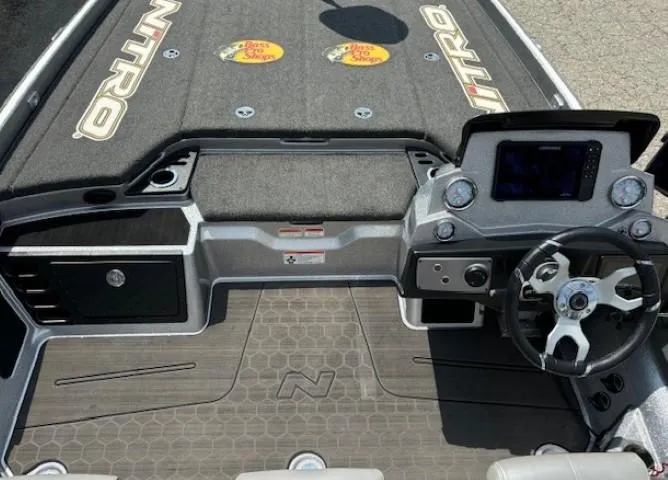Slide: The Image of 2023 Nitro Z21 XL boat interior with steering wheel and dashboard. - 23