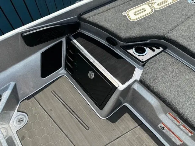 Slide: The Image of 2023 Nitro Z21 XL boat interior with storage compartment and cup holder. - 25