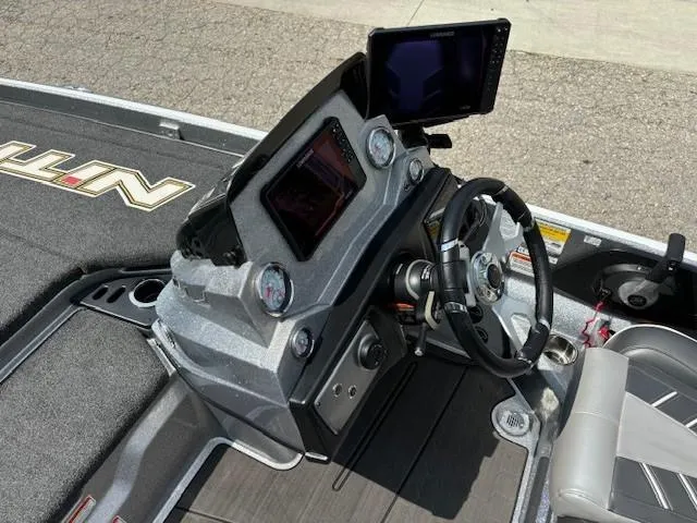 Slide: The Image of 2023 Nitro Z21 XL boat dashboard with steering wheel and electronic displays. - 28