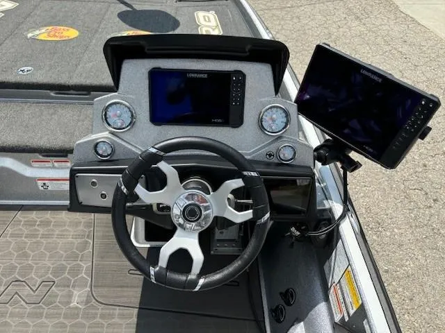 Slide: The Image of 2023 Nitro Z21 XL boat dashboard with steering wheel and electronic displays. - 29