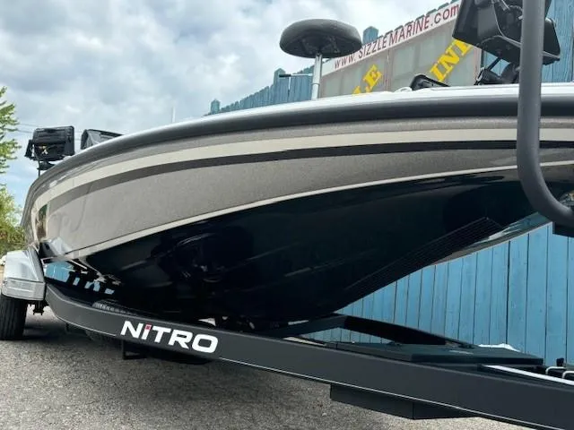 Slide: The Image of 2023 Nitro Z21 XL boat on trailer, sleek design, parked outdoors. - 3