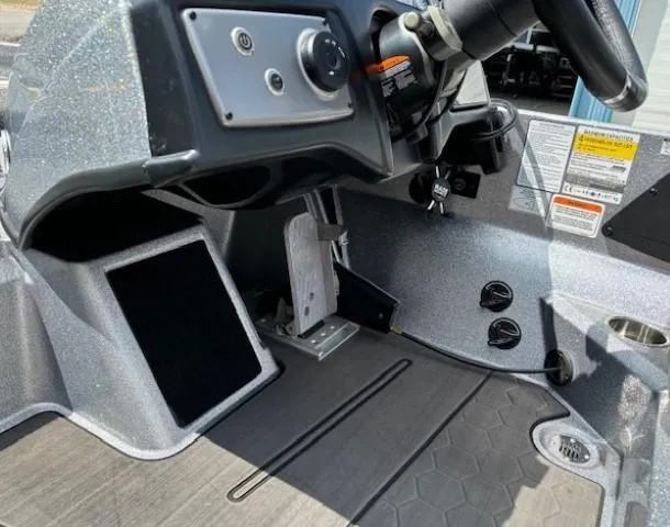Slide: The Image of 2023 Nitro Z21 XL boat cockpit with steering wheel and control panel. - 33