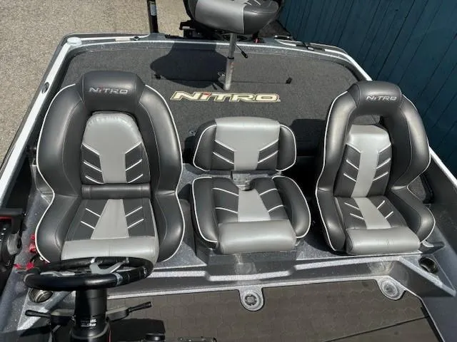 Slide: The Image of 2023 Nitro Z21 XL boat seats, gray and black design, three seats visible. - 34