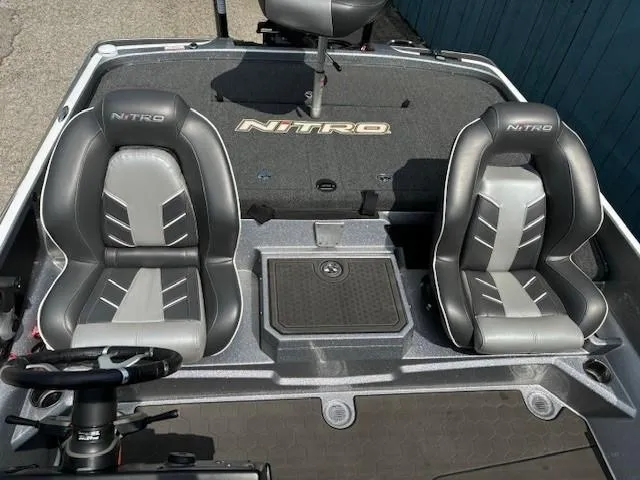 Slide: The Image of 2023 Nitro Z21 XL boat interior with dual seats and steering wheel. - 35