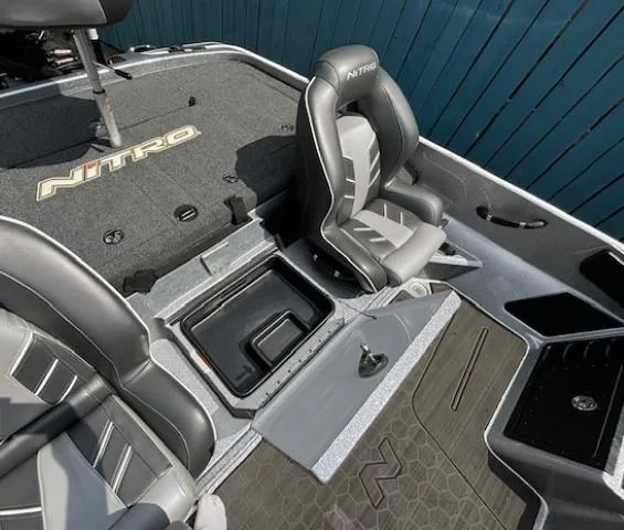 Slide: The Image of 2023 Nitro Z21 XL boat interior with sleek seating and storage compartments. - 36