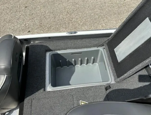 Slide: The Image of 2023 Nitro Z21 XL boat storage compartment with open lid, gray interior. - 40