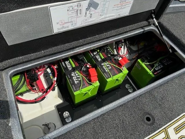 Slide: The Image of 2023 Nitro Z21 XL boat battery compartment with green Tracker batteries. - 42