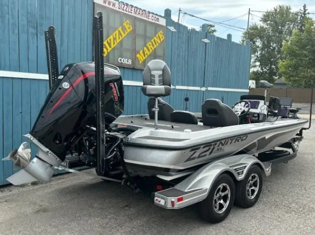 Slide: The Image of 2023 Nitro Z21 XL boat with powerful engine, parked at Sizzle Marine dealership. - 7