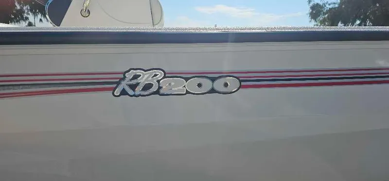 Slide: The Image of 2024 Ranger RB200 boat logo with red and blue stripes. - 2
