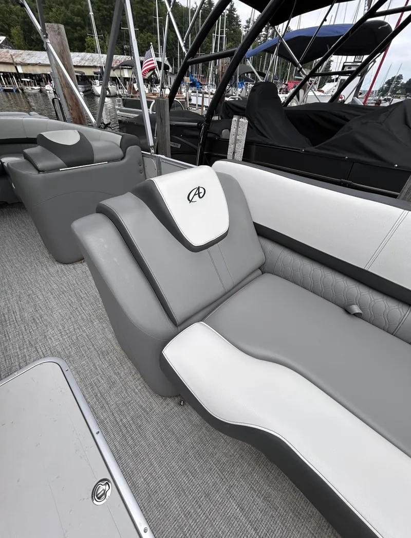 Slide: The Image of 2021 Avalon Catalina Cruise 25 boat interior with gray seating and sleek design. - 11