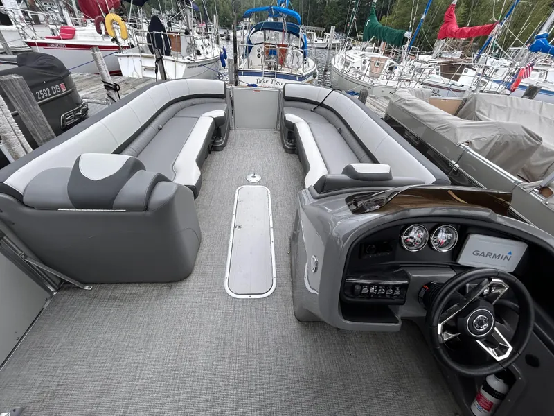 Slide: The Image of 2021 Avalon Catalina Cruise 25 pontoon boat interior with seating and steering console. - 15