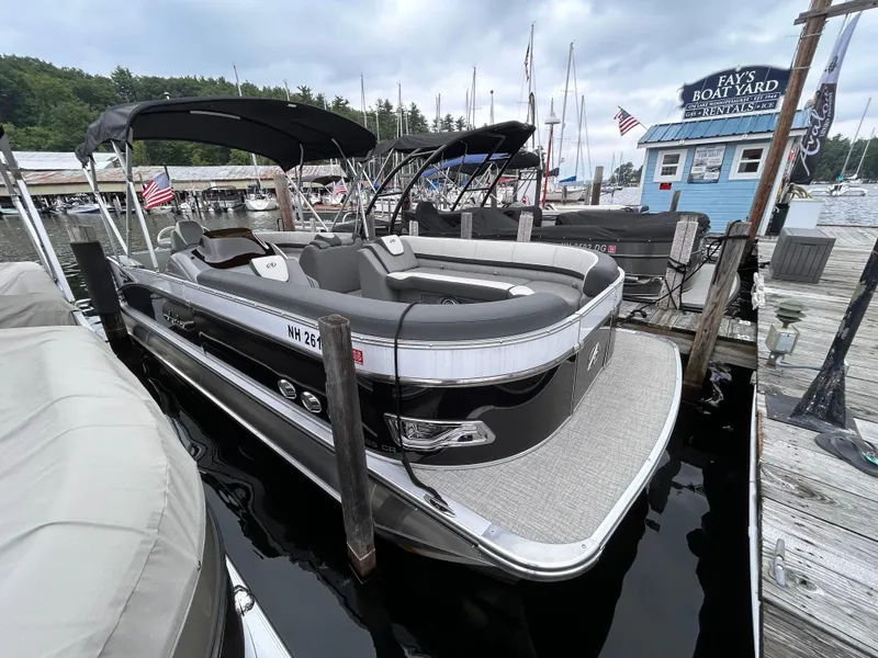 Slide: The Image of 2021 Avalon Catalina Cruise 25 pontoon boat docked at marina. - 2