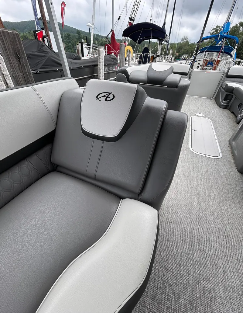 Slide: The Image of 2021 Avalon Catalina Cruise 25 boat interior with gray seating and sleek design. - 29