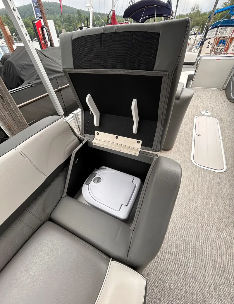 Slide: The Image of 2021 Avalon Catalina Cruise 25 boat seat storage compartment with built-in cooler. - 30