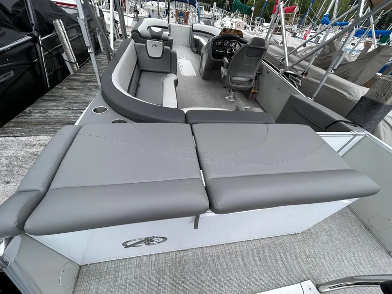 Slide: The Image of 2021 Avalon Catalina Cruise 25 boat with gray seating and modern interior design. - 33