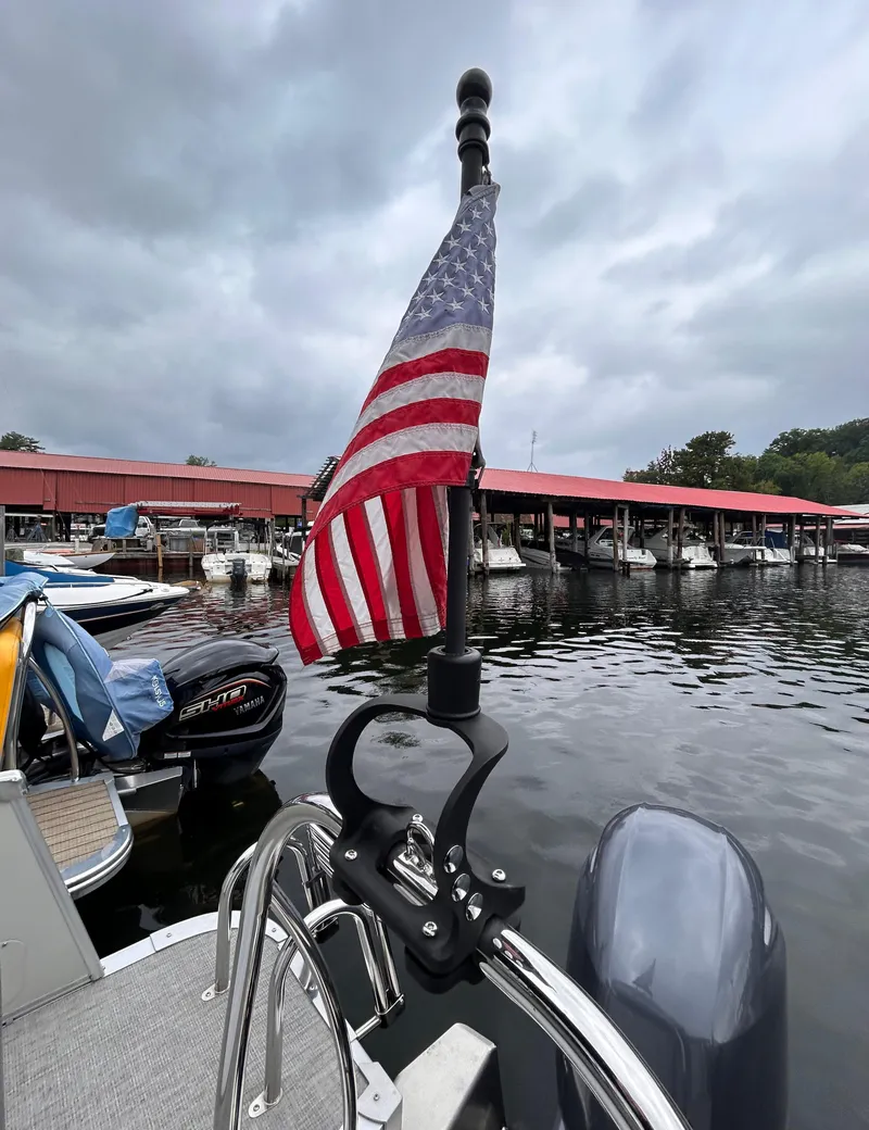 Slide: The Image of American flag on 2021 Avalon Catalina Cruise 25 boat at marina. - 39