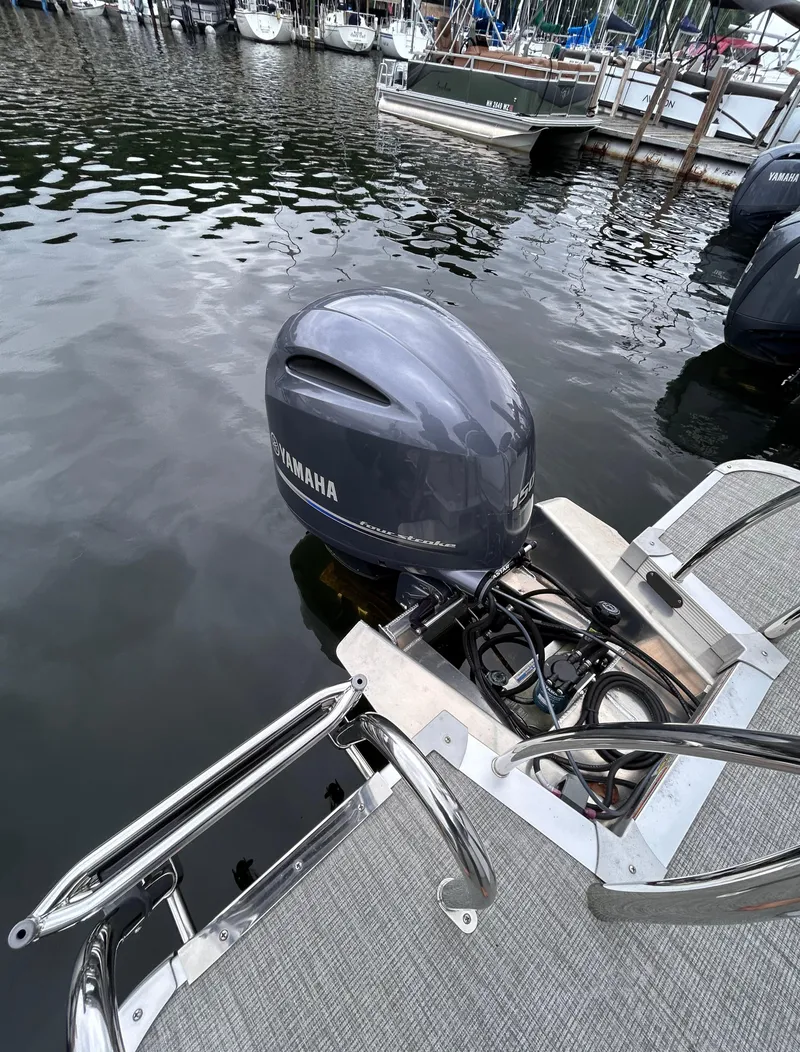 Slide: The Image of 2021 Avalon Catalina Cruise 25 with Yamaha outboard motor docked at marina. - 41