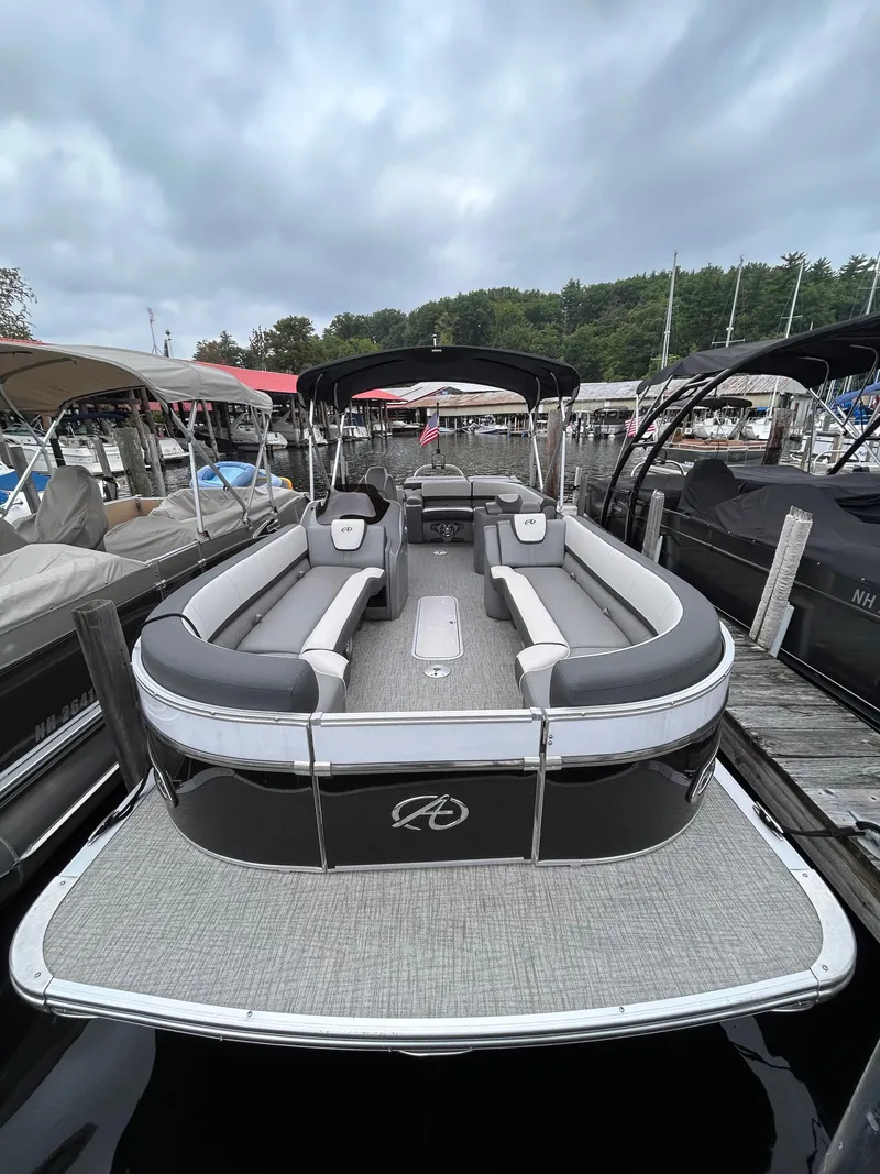 Slide: The Image of 2021 Avalon Catalina Cruise 25 pontoon boat docked, featuring spacious seating and sleek design. - 5