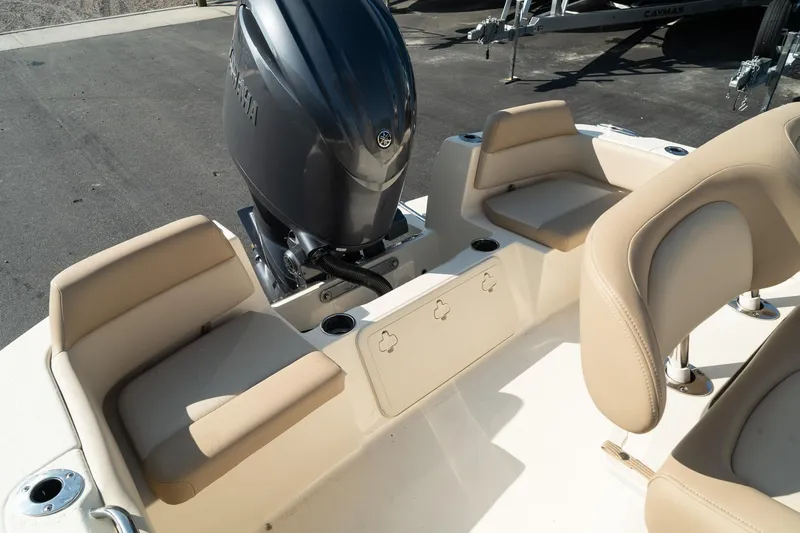 Slide: The Image of 2025 Scout 195 Sportfish boat interior with seating and outboard motor. - 14